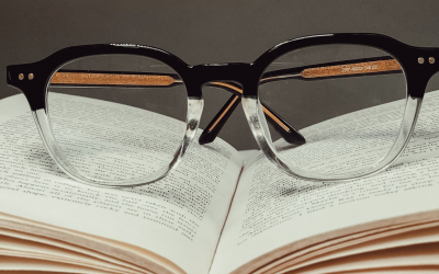 Reading glasses placed on book