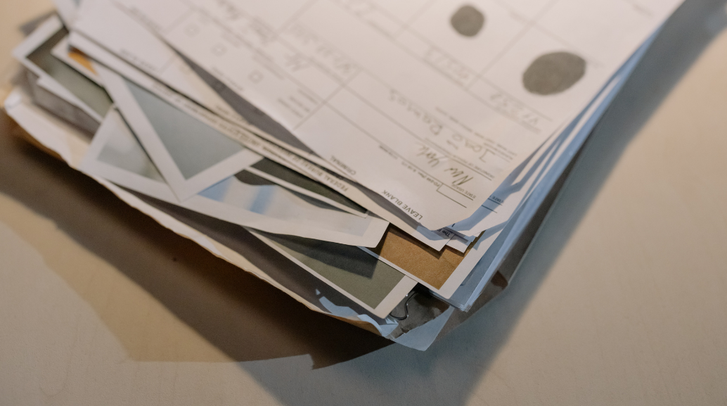 image of various documents piled on a table